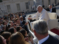 Pope Francis greets and talks with a group of students at the end of his general weekly audience in Vatican City, on November 6, 2024. (