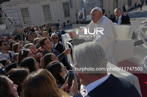 Pope Francis greets and talks with a group of students at the end of his general weekly audience in Vatican City, on November 6, 2024. 