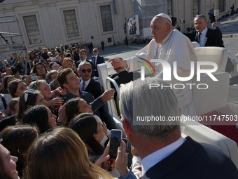 Pope Francis greets and talks with a group of students at the end of his general weekly audience in Vatican City, on November 6, 2024. (