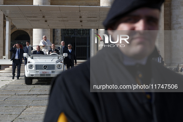 Pope Francis leaves St. Peter's Square in the Popemobile at the end of his general weekly audience in Vatican City, on November 6, 2024. 