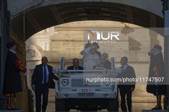 Pope Francis arrives in St. Peter's Square in the Popemobile to lead his general weekly audience at the Vatican on November 6, 2024. 