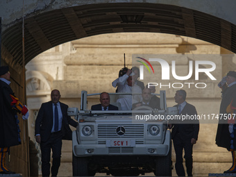 Pope Francis arrives in St. Peter's Square in the Popemobile to lead his general weekly audience at the Vatican on November 6, 2024. (