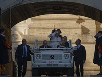 Pope Francis arrives in St. Peter's Square in the Popemobile to lead his general weekly audience at the Vatican on November 6, 2024. (