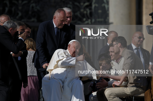 Pope Francis leaves at the end of the weekly general audience in St. Peter's Square, at the Vatican, on November 6, 2024 