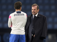 Angel Torres Sanchez, President of Getafe CF, talks with Luis Milla of Getafe CF before the La Liga EA Sports match between RC Celta de Vigo...