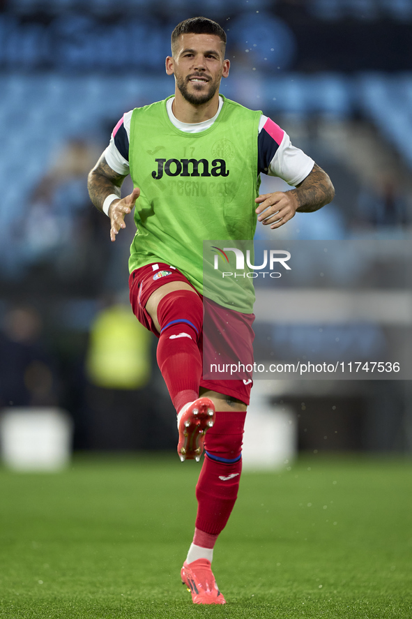 Carles Perez of Getafe CF warms up before the La Liga EA Sports match between RC Celta de Vigo and Getafe CF at Estadio Abanca Balaidos in V...