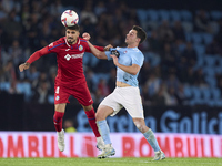 Anastasios Douvikas of RC Celta de Vigo competes for the ball with Juan Berrocal of Getafe CF during the La Liga EA Sports match between RC...