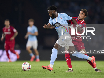 Luis Milla of Getafe CF competes for the ball with Jonathan Bamba of RC Celta de Vigo during the La Liga EA Sports match between RC Celta de...