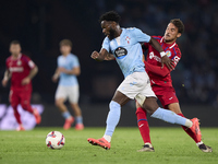 Luis Milla of Getafe CF competes for the ball with Jonathan Bamba of RC Celta de Vigo during the La Liga EA Sports match between RC Celta de...