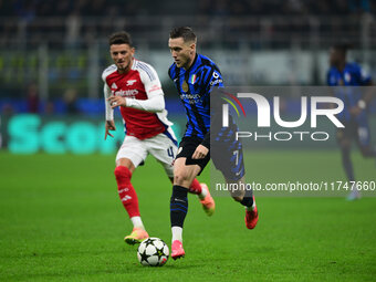 Piotr Zielinski of Inter Milan is in action during the Champions League match between Inter Milan and Arsenal at San Siro Stadium in Bergamo...