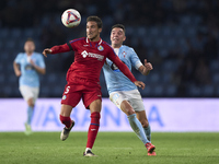 Iago Aspas of RC Celta de Vigo competes for the ball with Luis Milla of Getafe CF during the La Liga EA Sports match between RC Celta de Vig...