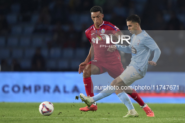 Alvaro Rodriguez of Getafe CF competes for the ball with Hugo Sotelo of RC Celta de Vigo during the La Liga EA Sports match between RC Celta...