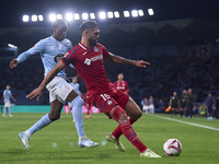 Ilaix Moriba of RC Celta de Vigo competes for the ball with Omar Alderete of Getafe CF during the La Liga EA Sports match between RC Celta d...