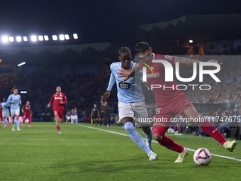 Ilaix Moriba of RC Celta de Vigo competes for the ball with Omar Alderete of Getafe CF during the La Liga EA Sports match between RC Celta d...