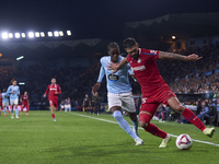 Ilaix Moriba of RC Celta de Vigo competes for the ball with Omar Alderete of Getafe CF during the La Liga EA Sports match between RC Celta d...