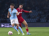 Juan Iglesias of Getafe CF competes for the ball with Oscar Mingueza of RC Celta de Vigo during the La Liga EA Sports match between RC Celta...