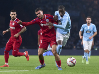 Juan Iglesias of Getafe CF competes for the ball with Ilaix Moriba of RC Celta de Vigo during the La Liga EA Sports match between RC Celta d...