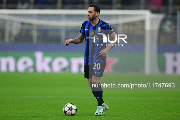 Hakan Calhanoglu of Inter Milan is in action during the Champions League match between Inter Milan and Arsenal at San Siro Stadium in Bergam...