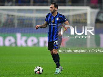 Hakan Calhanoglu of Inter Milan is in action during the Champions League match between Inter Milan and Arsenal at San Siro Stadium in Bergam...