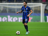 Hakan Calhanoglu of Inter Milan is in action during the Champions League match between Inter Milan and Arsenal at San Siro Stadium in Bergam...