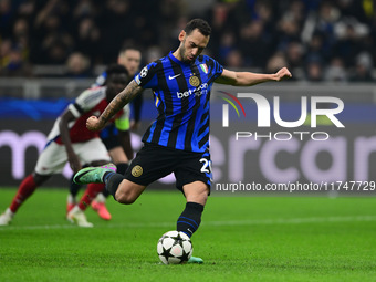 Hakan Calhanoglu of Inter Milan scores a goal during the Champions League match between Inter Milan and Arsenal at San Siro Stadium in Berga...