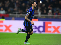 Hakan Calhanoglu of Inter Milan celebrates after scoring his team's first goal during the Champions League match between Inter Milan and Ars...