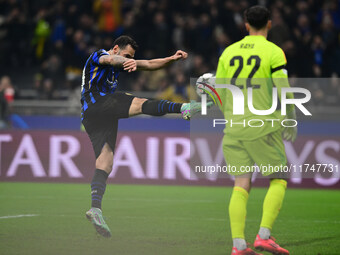 Hakan Calhanoglu of Inter Milan celebrates after scoring his team's first goal during the Champions League match between Inter Milan and Ars...