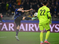 Hakan Calhanoglu of Inter Milan celebrates after scoring his team's first goal during the Champions League match between Inter Milan and Ars...