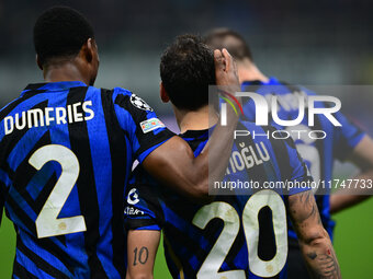 Hakan Calhanoglu of Inter Milan celebrates after scoring his team's first goal during the Champions League match between Inter Milan and Ars...