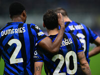 Hakan Calhanoglu of Inter Milan celebrates after scoring his team's first goal during the Champions League match between Inter Milan and Ars...