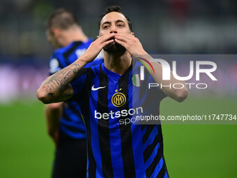 Hakan Calhanoglu of Inter Milan celebrates after scoring his team's first goal during the Champions League match between Inter Milan and Ars...