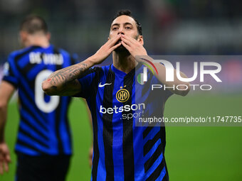 Hakan Calhanoglu of Inter Milan celebrates after scoring his team's first goal during the Champions League match between Inter Milan and Ars...