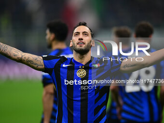 Hakan Calhanoglu of Inter Milan celebrates after scoring his team's first goal during the Champions League match between Inter Milan and Ars...