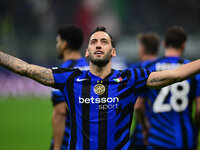 Hakan Calhanoglu of Inter Milan celebrates after scoring his team's first goal during the Champions League match between Inter Milan and Ars...