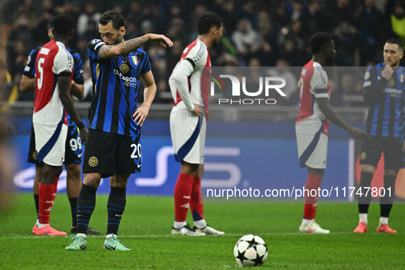 Hakan Calhanoglu of F.C. Inter plays during the UEFA Champions League 2024/25 League Phase MD4 match between F.C. Inter and Arsenal F.C. at...