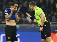 Hakan Calhanoglu of F.C. Inter and Referee Istvan Kovacs (ROU) are present during the UEFA Champions League 2024/25 League Phase MD4 match b...