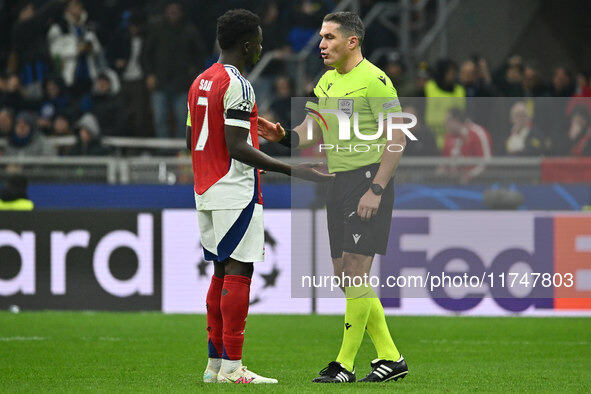 Bukayo Saka of Arsenal F.C. and Referee Istvan Kovacs (ROU) are present during the UEFA Champions League 2024/25 League Phase MD4 match betw...