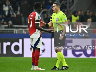 Bukayo Saka of Arsenal F.C. and Referee Istvan Kovacs (ROU) are present during the UEFA Champions League 2024/25 League Phase MD4 match betw...