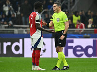 Bukayo Saka of Arsenal F.C. and Referee Istvan Kovacs (ROU) are present during the UEFA Champions League 2024/25 League Phase MD4 match betw...