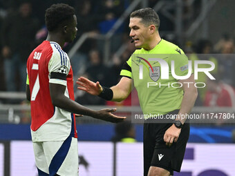 Bukayo Saka of Arsenal F.C. and Referee Istvan Kovacs (ROU) are present during the UEFA Champions League 2024/25 League Phase MD4 match betw...