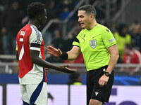 Bukayo Saka of Arsenal F.C. and Referee Istvan Kovacs (ROU) are present during the UEFA Champions League 2024/25 League Phase MD4 match betw...