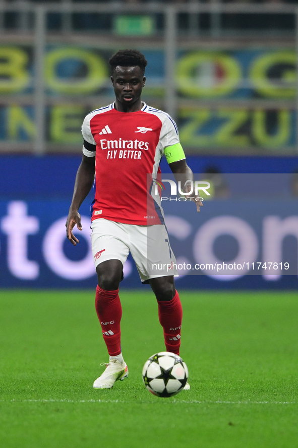 Bukayo Saka of Arsenal is in action during the Champions League match between Inter Milan and Arsenal at San Siro Stadium in Bergamo, Italy,...