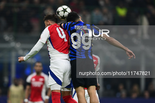 Ben White of Arsenal and Mehdi Taremi of Inter Milan battle for the ball during the Champions League match between Inter Milan and Arsenal a...