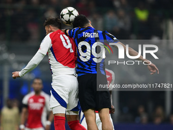 Ben White of Arsenal and Mehdi Taremi of Inter Milan battle for the ball during the Champions League match between Inter Milan and Arsenal a...