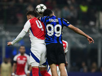 Ben White of Arsenal and Mehdi Taremi of Inter Milan battle for the ball during the Champions League match between Inter Milan and Arsenal a...