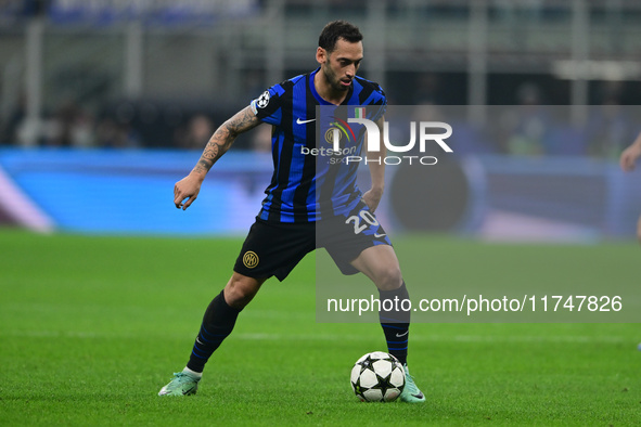 Hakan Calhanoglu of Inter Milan is in action during the Champions League match between Inter Milan and Arsenal at San Siro Stadium in Bergam...