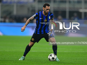 Hakan Calhanoglu of Inter Milan is in action during the Champions League match between Inter Milan and Arsenal at San Siro Stadium in Bergam...