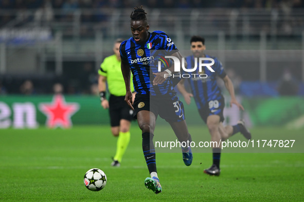 Yann Aurel Bisseck of Inter Milan is in action during the Champions League match between Inter Milan and Arsenal at San Siro Stadium in Berg...