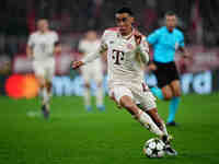 Jamal Musiala of Bayern Munich  controls the ball during the Champions League Round 4 match between Bayern Munich v Benfica at the Allianz a...