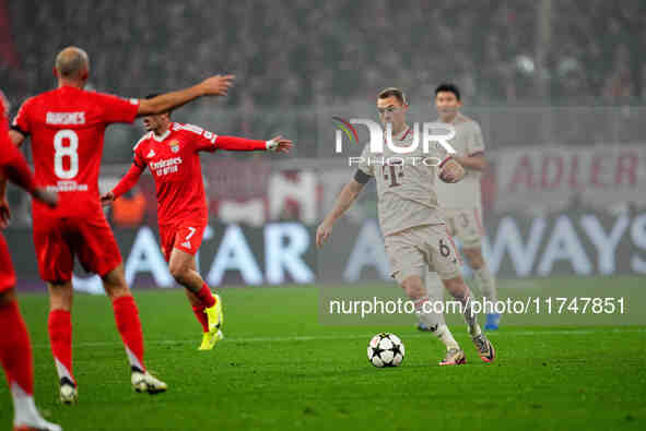 Joshua Kimmich of Bayern Munich  controls the ball during the Champions League Round 4 match between Bayern Munich v Benfica at the Allianz...